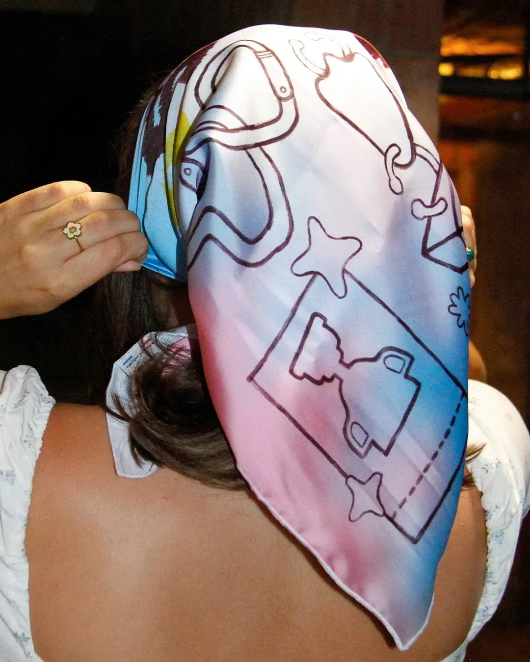 A Collectif Badaboum scarf, worn tied over the head.